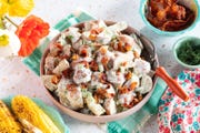 red potato salad with corn, bacon, and flowers