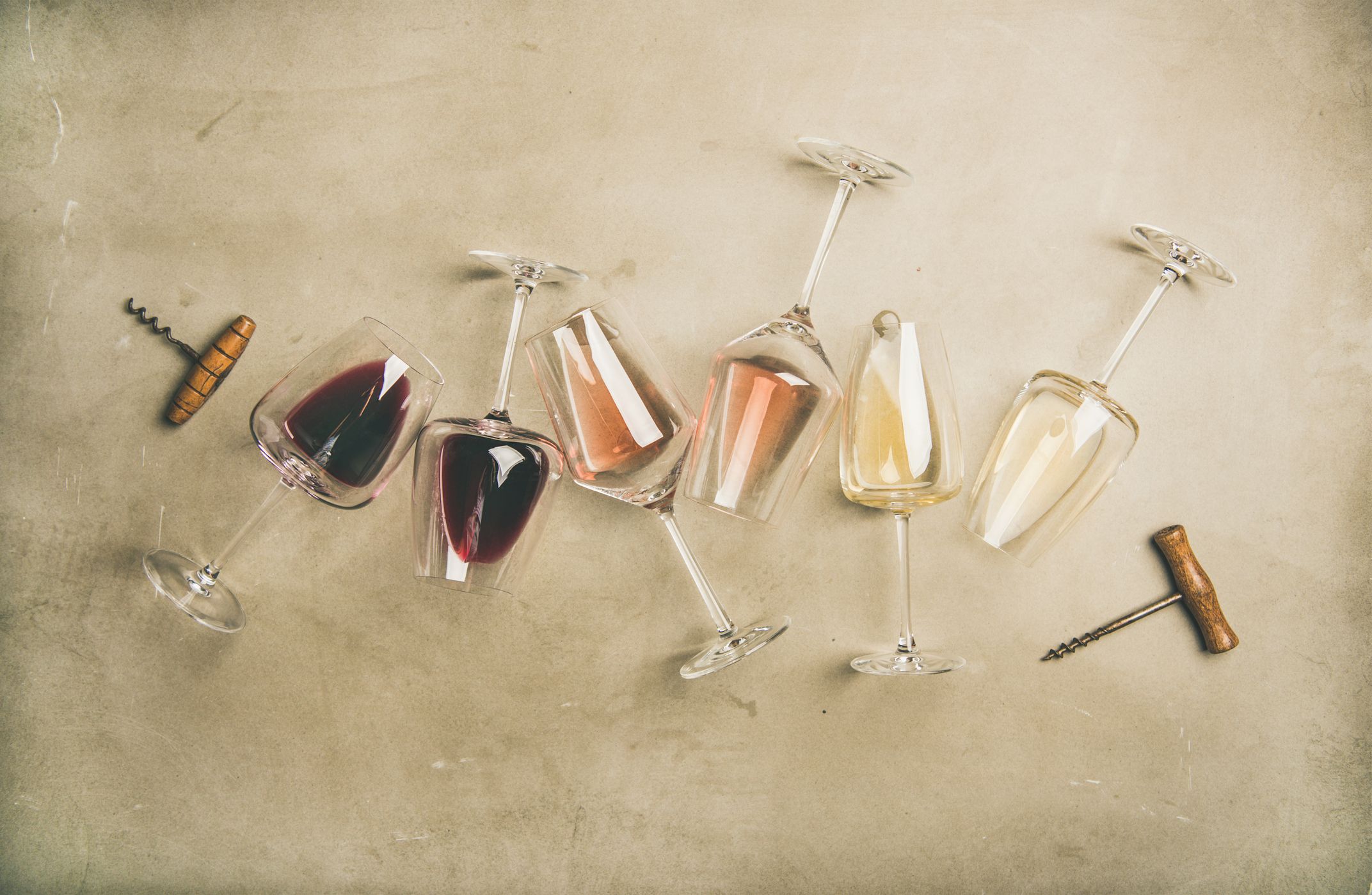 https://hips.hearstapps.com/hmg-prod/images/red-rose-and-white-wine-in-glasses-and-corkscrews-royalty-free-image-1597178965.jpg