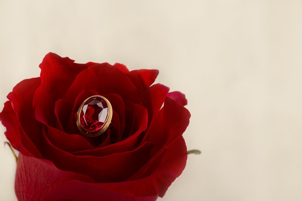 red rose flower and gold ring with red ruby a gift to your beloved greeting card mockup