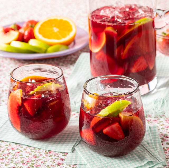 red sangria, two glasses with pitcher and plate of fruit