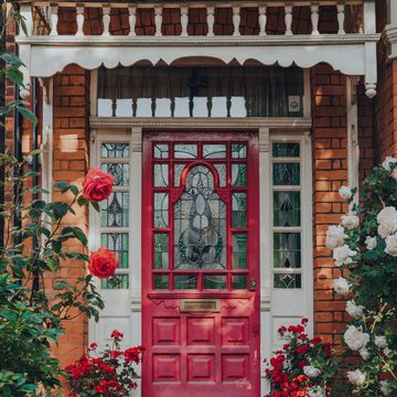 london, uk   may 30, 2020 dark pink stained glass front door of a traditional edwardian house in london, selective focus edwardian houses promote simple design and an appreciation for the handmade