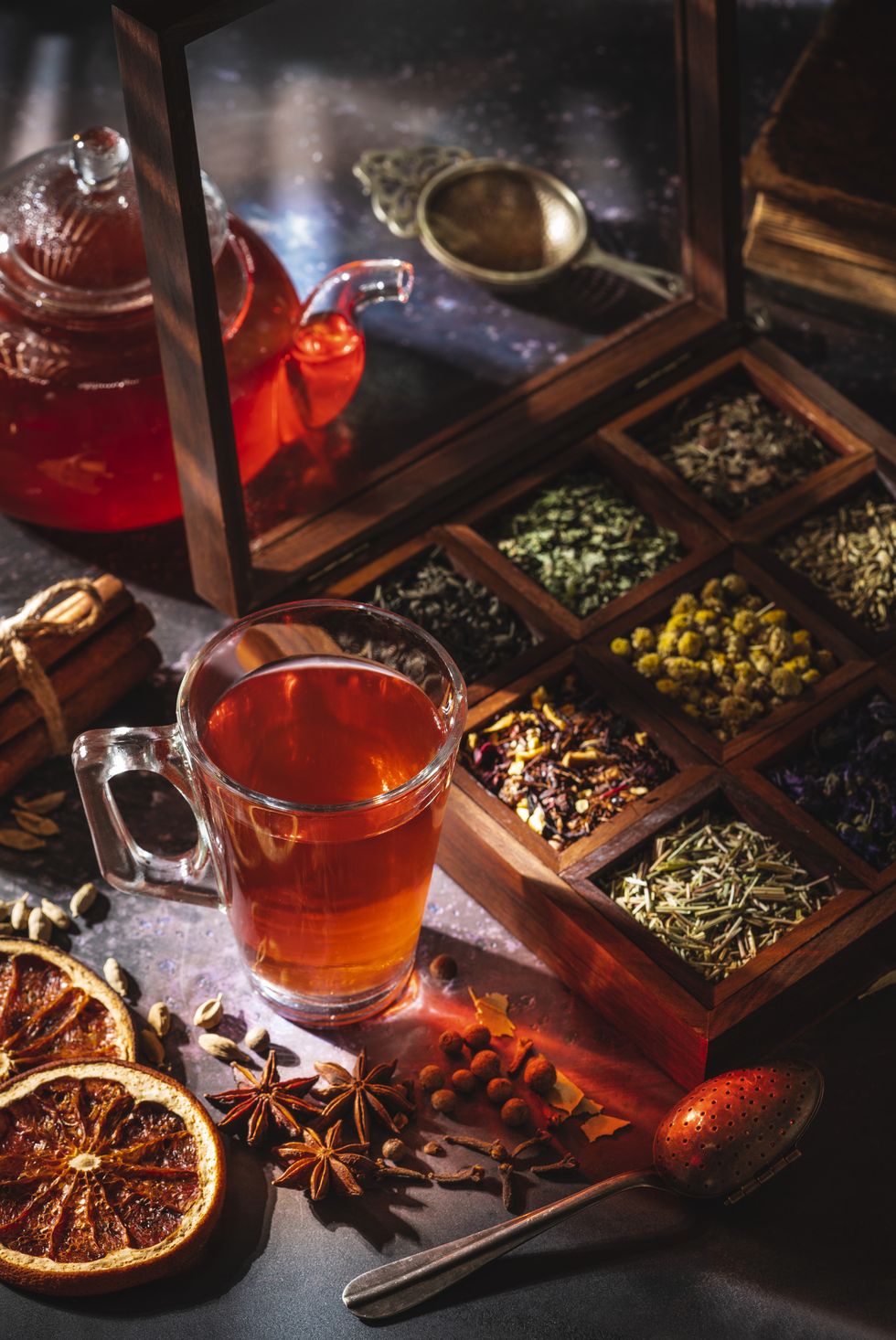 red tea with a box of tea herbs and aromatic spices