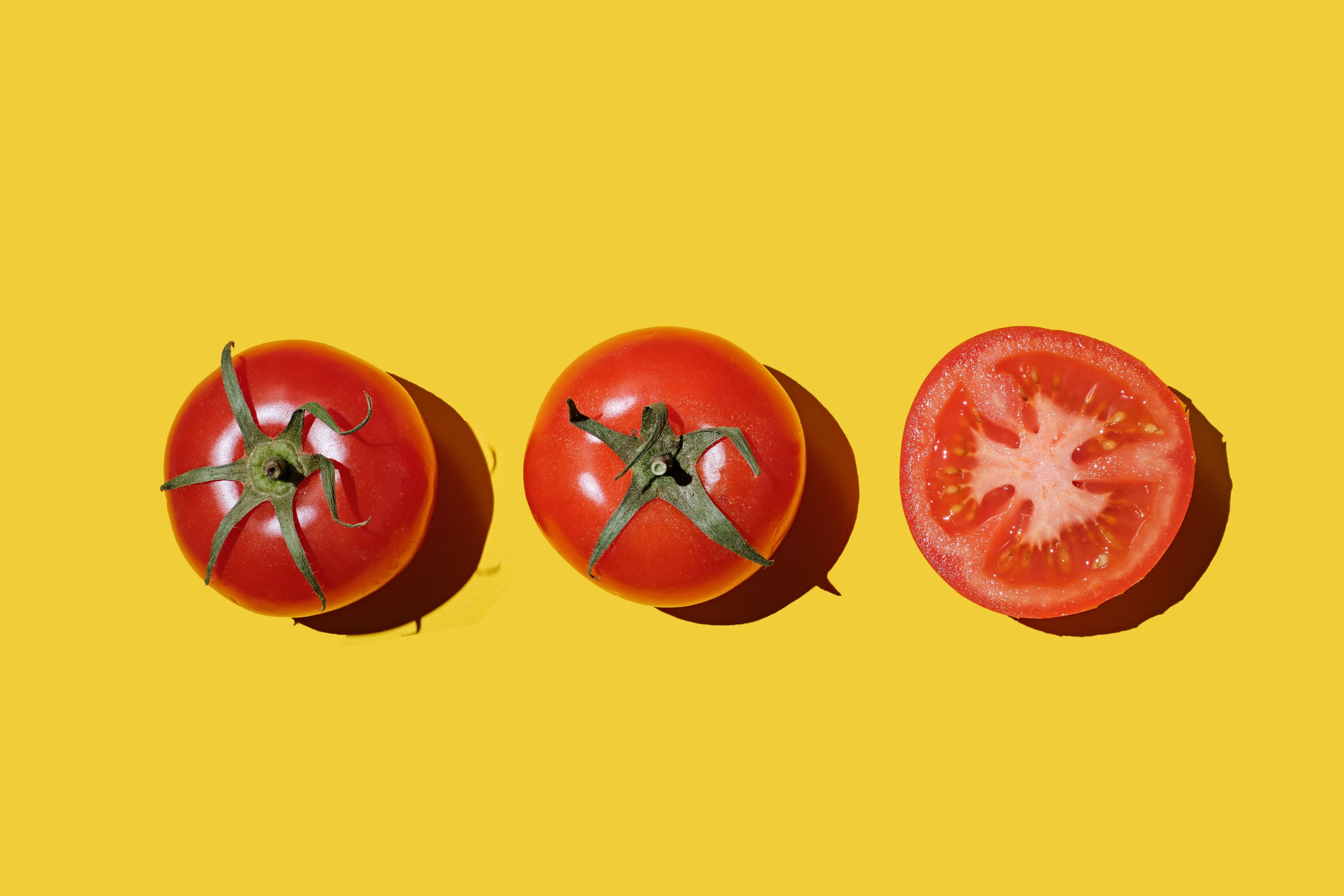 red-tomatoes-on-yellow-background-flat-lay-top-view-royalty-free-image-1752006245.pjpeg