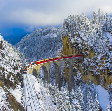 red train in winter wonderland