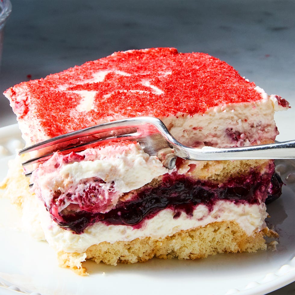 ladyfingers layered with mascarpone, blueberry jam, and strawberries
