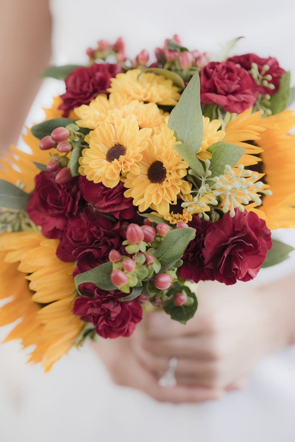 red and yellow fall wedding bouquets