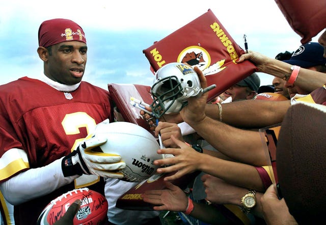 07202000 redskins camp deion sanders signs autographs at the end of practice photo by rich 