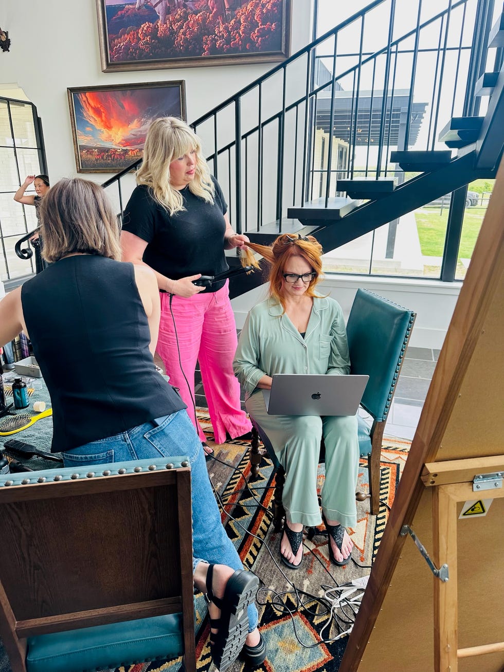 Ree Drummond Paige Drummond Wedding Women preparing for a photo shoot in an elegant inner setting