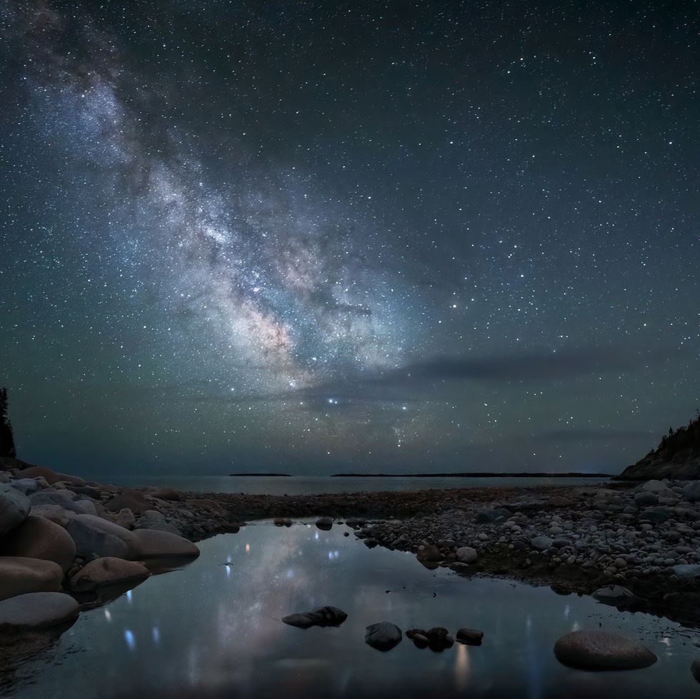 reflection of stars and the milky way on the beach at hunter's beach, acadia national park, maine