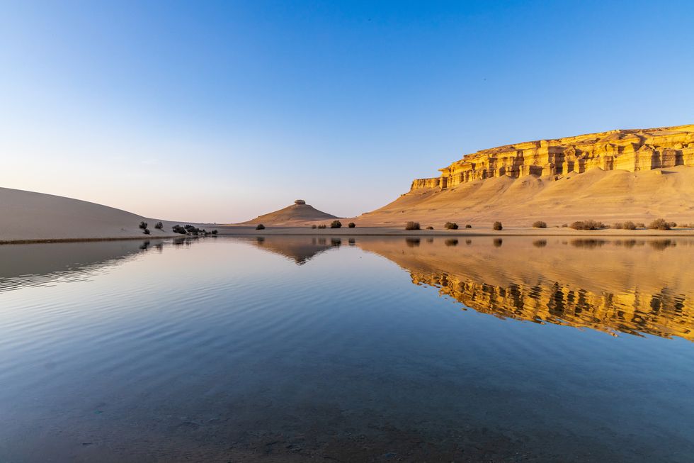 reflections in qarun lake in the desert at faiyum oasis