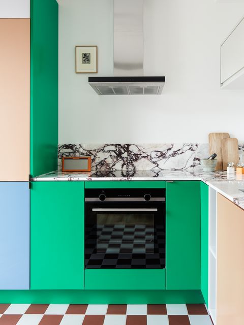 colorful cabinets with marble backsplash