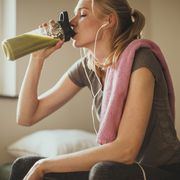 not hungry after a workout, woman drinking smoothie