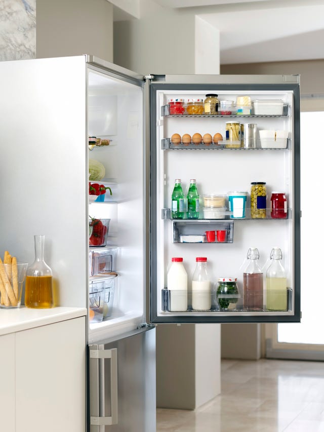 fridge door open with food inside