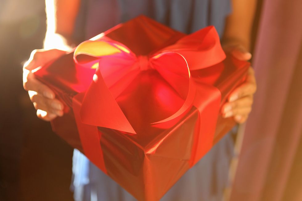 Woman holding wrapped gift