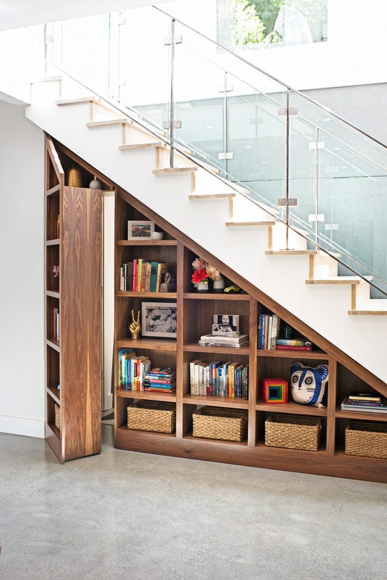 a bookshelf with books and a basket on it