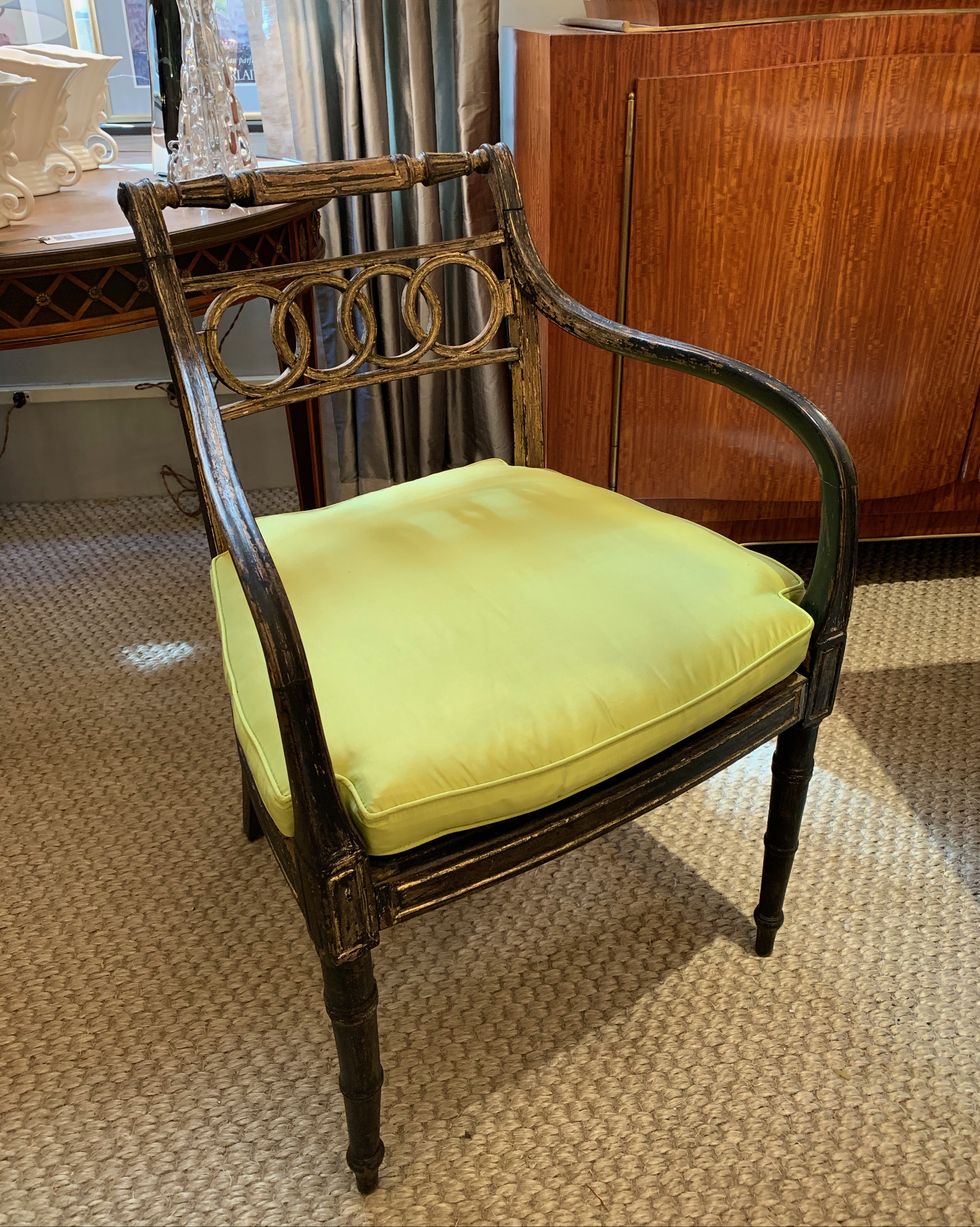 reupholstered chair wit green fabric