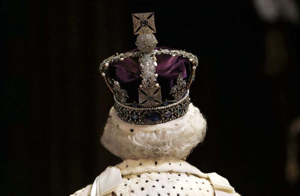 london, england   may 27  queen elizabeth ii proceeds through the royal gallery before the state opening of parliament in the house of lords at the palace of westminster on may 27, 2015 in london, england photo by suzanne plunkett wpa poolgetty images