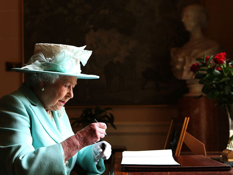 belfast, northern ireland   june 25  queen elizabeth ii signs the visitor book prior to departing hillsborough castle, on the third and final day of the queens visit to northern ireland, on june 25, in belfast, northern ireland photo by brian lawless   wpa poolgetty images