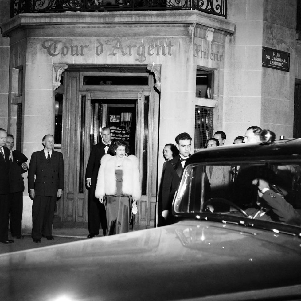 princess elizabeth of england, wearing an evening gown and a fur coat, and her husband philip, duke of edinburgh, leave the tour dargent restaurant after having dinner, on may 16, 1948 in paris, to go to one of the citys most popular nightclubs, chez carrere in the rue pierre charron, near the champs elysées avenue during their official visit in france   three years after the end of the second world war, the twenty two year old princess, accompanied by her husband and pregnant with the future prince charles, made a four day official visit to paris, her first trip outside the commonwealth photo by    afp photo by  afp via getty images