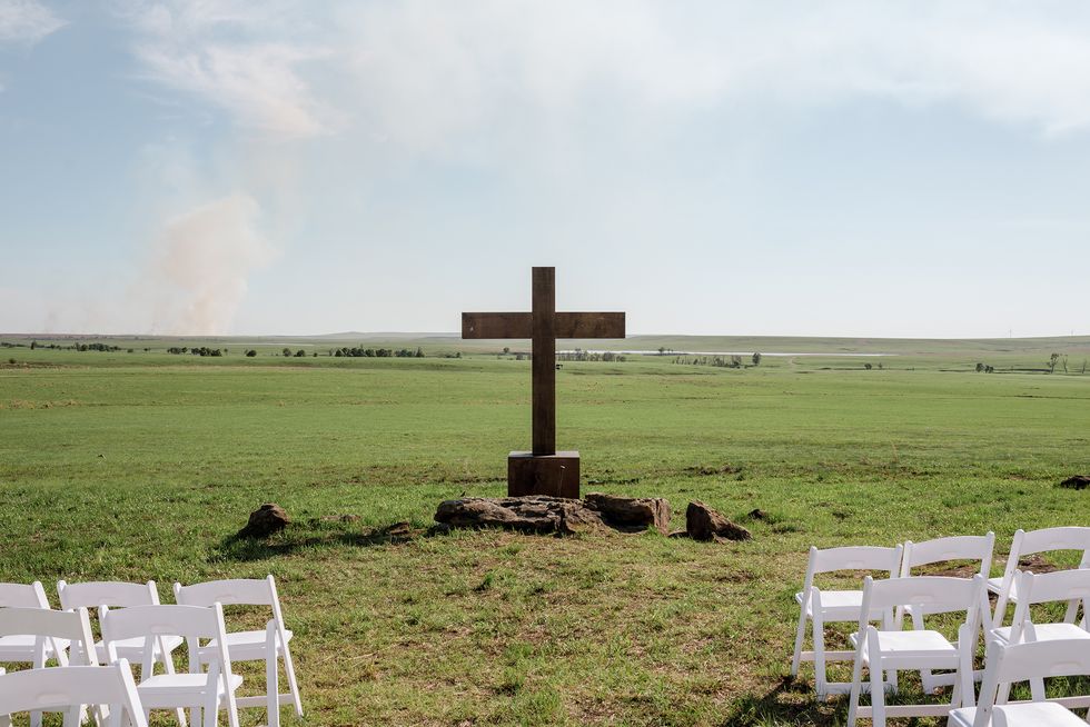 the wooden cross at the site of alex and mauricio's wedding