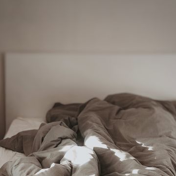 a person lays in a bed