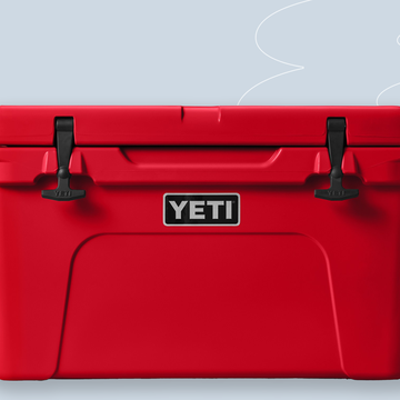a red suitcase with a white tag