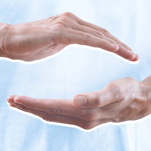 a picture of one hand hovering over another
