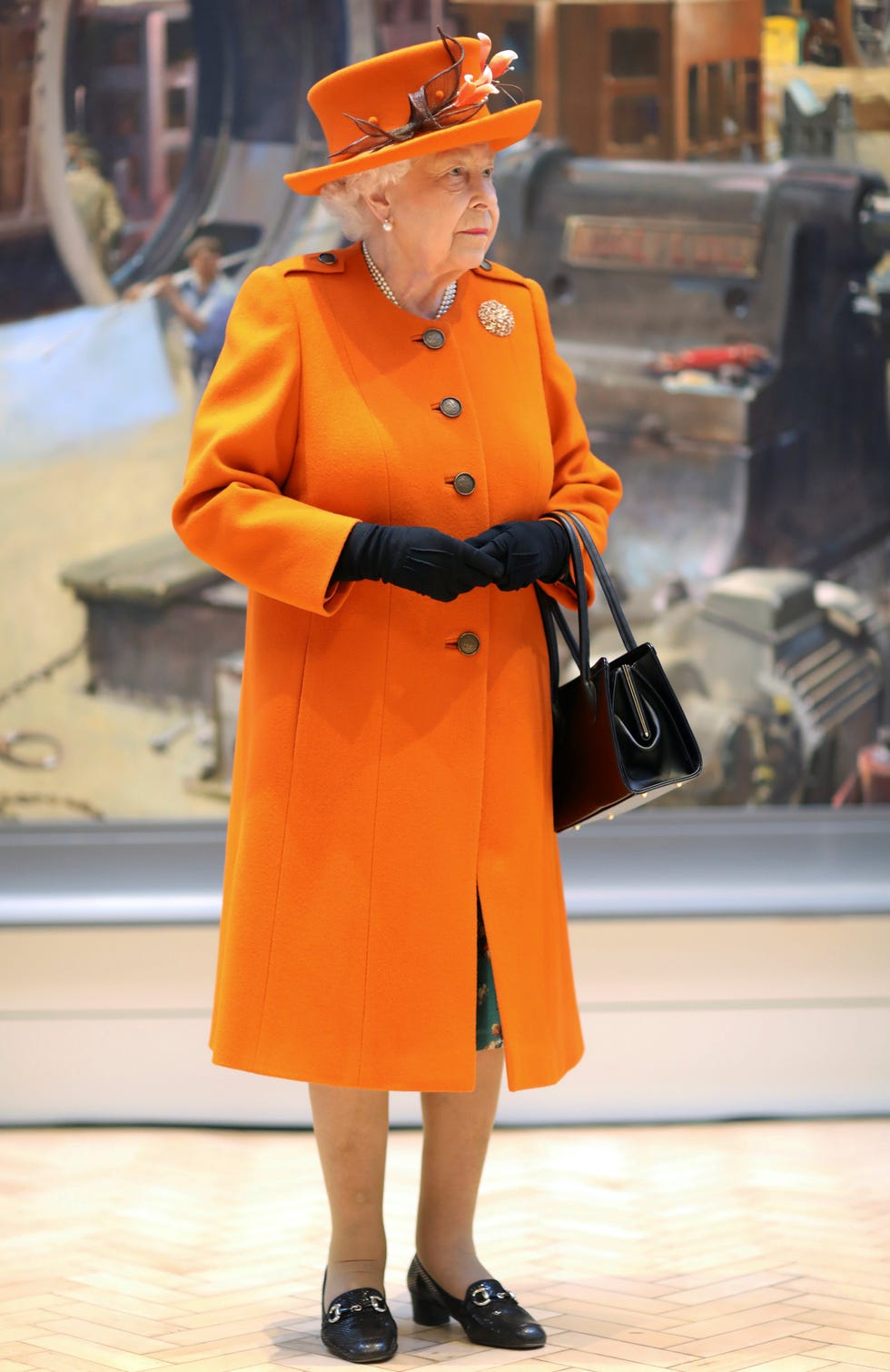 clothing, street fashion, orange, fashion, overcoat, yellow, coat, standing, outerwear, trench coat,