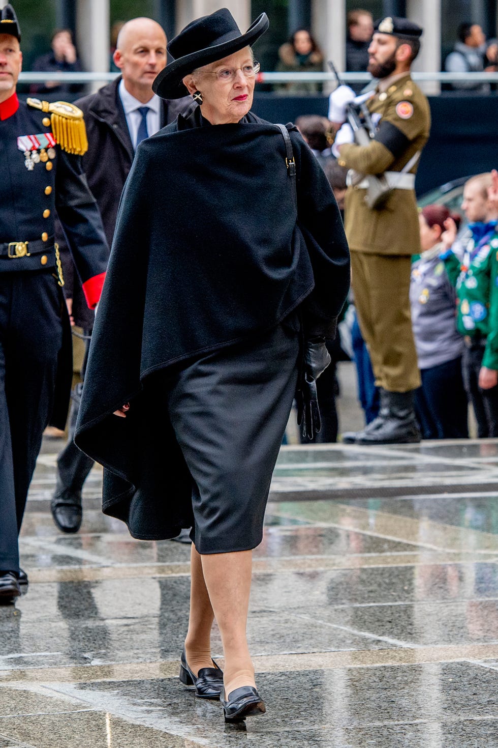 Fashion, Street fashion, Outerwear, Human, Joint, Footwear, Headgear, Coat, Event, Dress, 