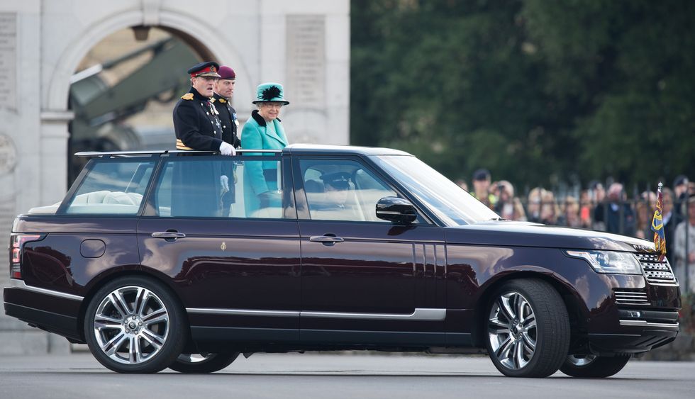 chatham, england   october 13  queen elizabeth ii rides in an open top range rover as she visits the corps of royal engineers at brompton barracks in celebration of their 300th anniversary on october 13, 2016 in chatham, england  photo by samir husseinwireimage