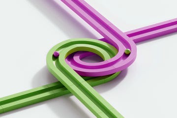 digitally generated image of rolling objects that follow a set path. marble run. the concept of choice. image showing the different choices in the same time can create the different results