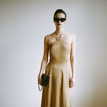 a person wearing a dress and sunglasses