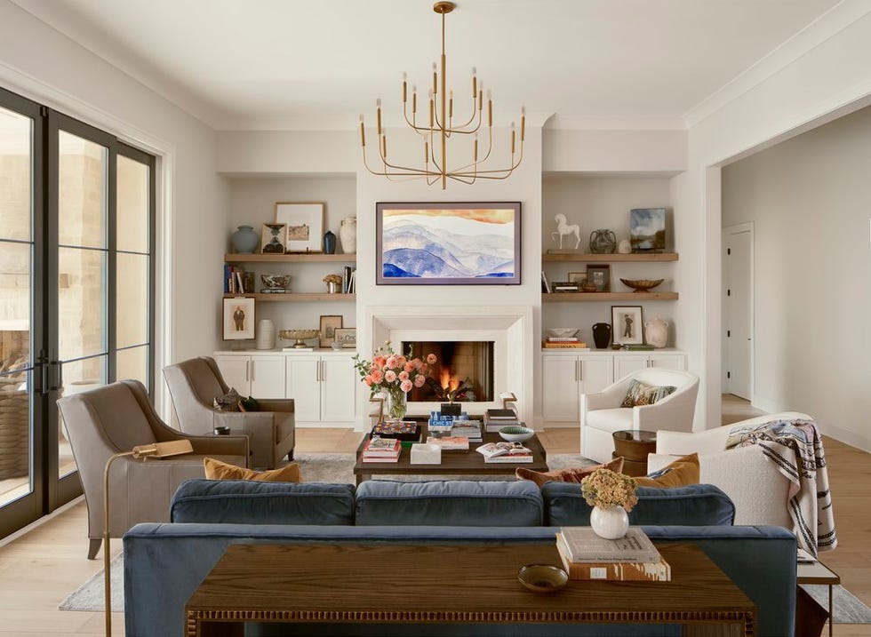 cozy modern living room with a fireplace and decorative shelves