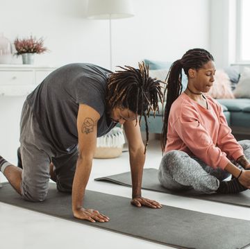 relaxing couple exercise at home