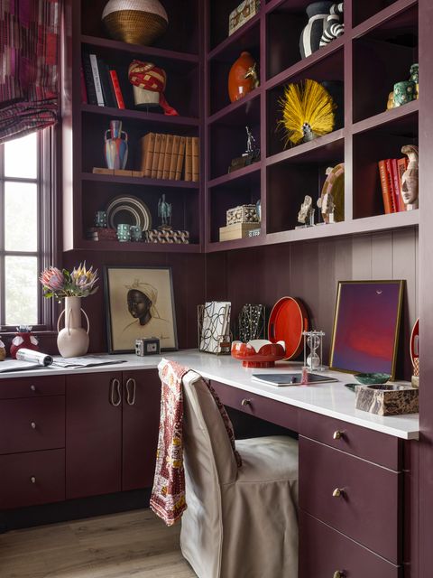 office bethea designed the office to have plenty of workspace, with a wraparound desk for two an abundance of closed storage houses all the practical but less pretty components of office work, while open shelving above shows off a rich collection of objets and books chair lee industries art james derit, minted