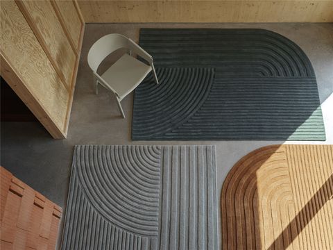 a set of three curved area rugs