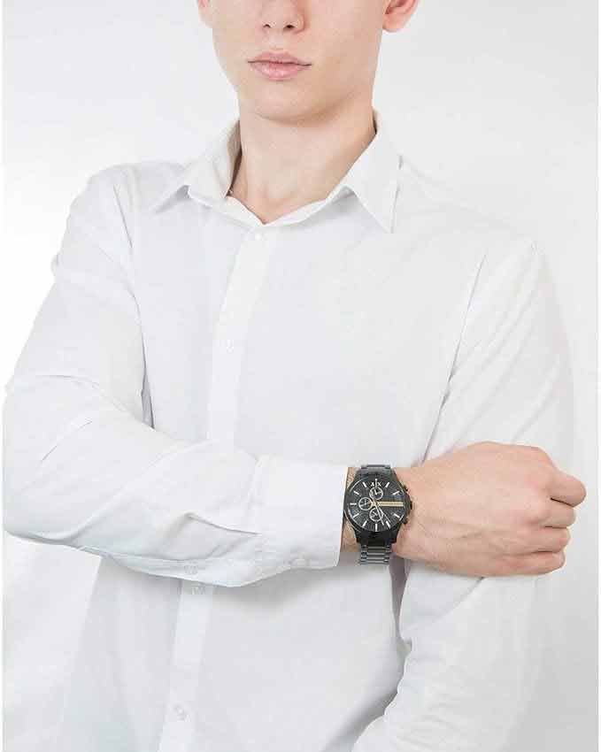 a person wearing a white shirt and a watch