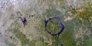 Remnants of one of the largest impact craters still preserved on the surface of the Earth. Occurring about 212 million years ago. Lake Manicouagan in northern Quebec, Canada. June 1, 2001.