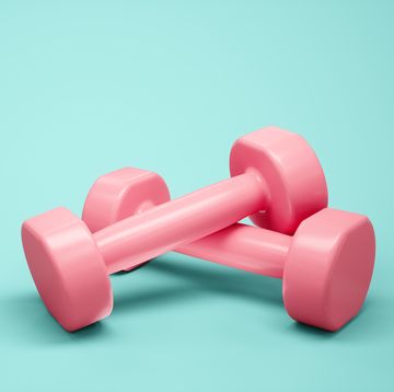 3d rendering pink dumbbells for sports isolated on blue background