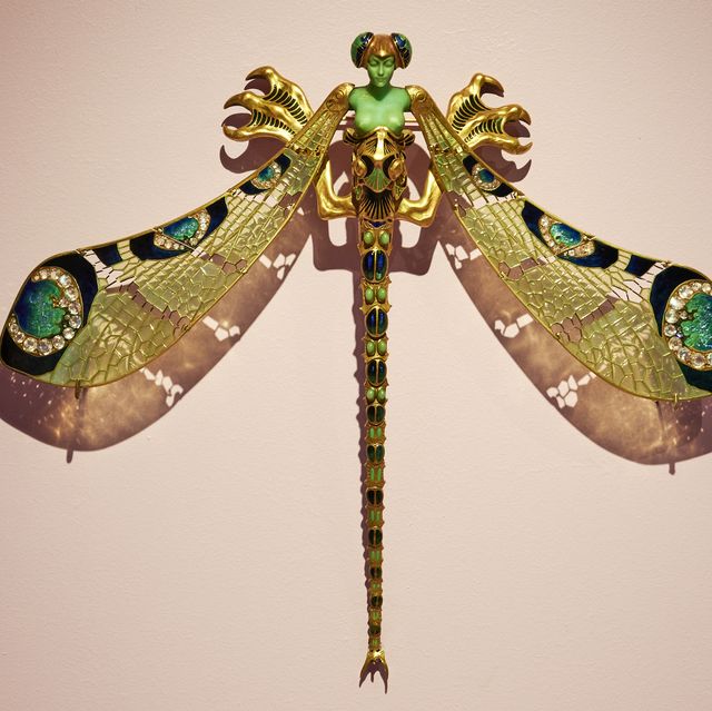 lisbon, portugal   october 29 "dragonfly woman" art nouveau brooch made of gold, enamel, chrysoprase, diamond and moonstone, on display at the "rené lalique e a idade do vidro, arte e indústria" during the covid 19 coronavirus pandemic on october 29, 2020 in lisbon, portugal three decades after the last exhibition entirely dedicated to french glass designer rené lalique 1860 1945, the gulbenkian foundation exhibits a hundred pieces from the artist's extraordinary glass production, including jewelry, decorative pieces and objects for daily use in addition to pieces belonging to the gulbenkian museum this exhibition includes a set of works from the lalique museum wingen sur moder and some of the most important international private collections photo by horacio villaloboscorbiscorbis via getty images
