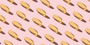 repeated fish oil pills on pink background