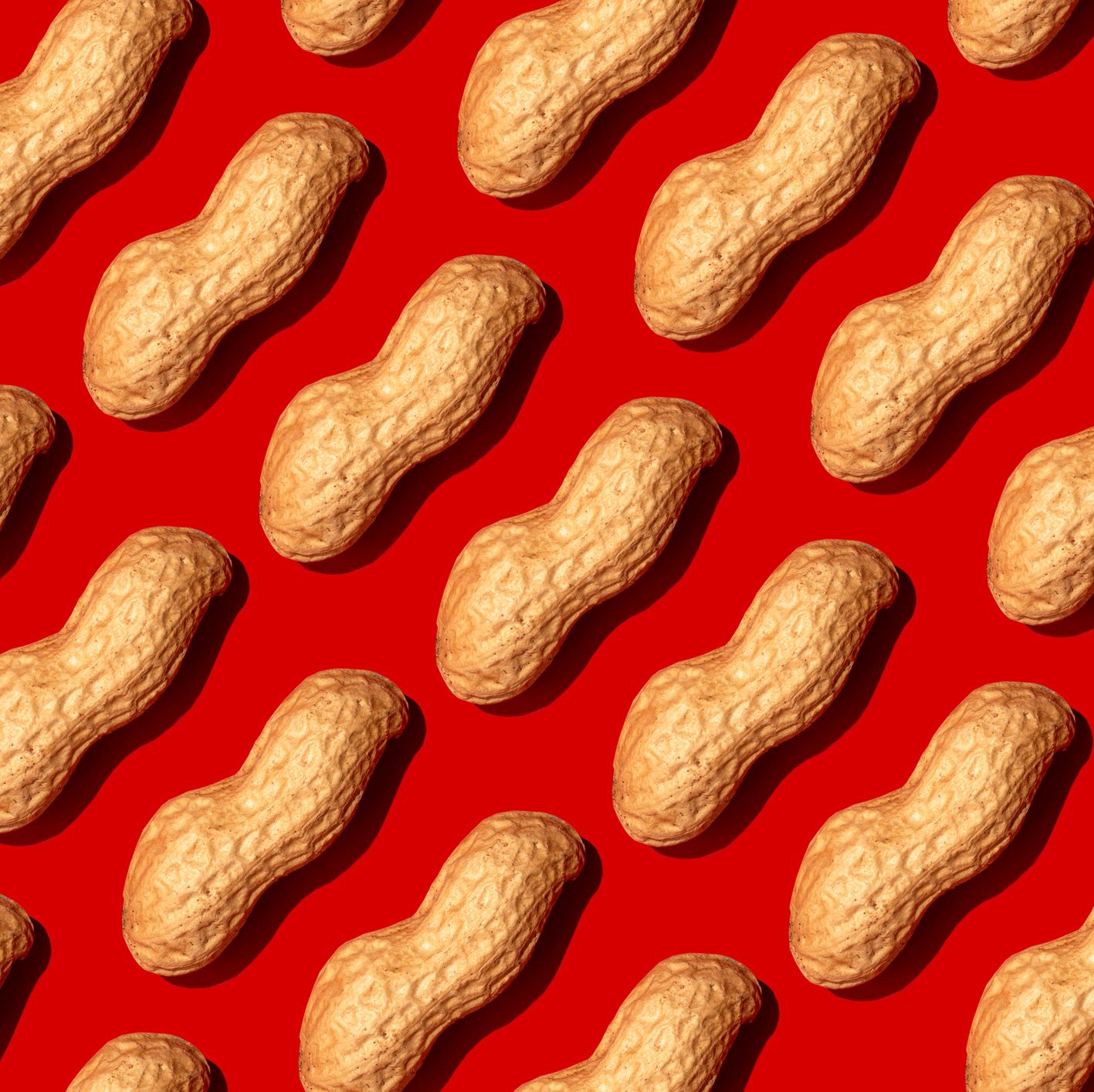 repeated nuts on the red background