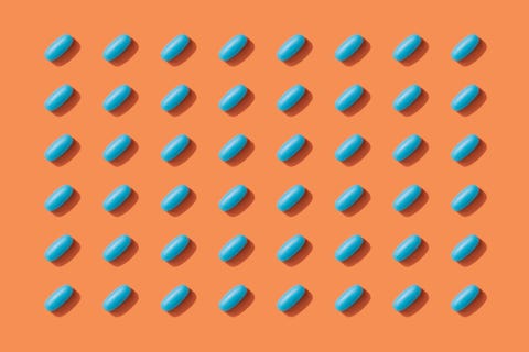 repeated pills on orange color background