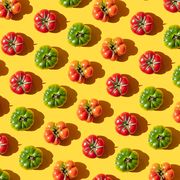 repeated red and green tomatoes on the yellwo background
