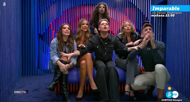 a group of people sitting on a stage