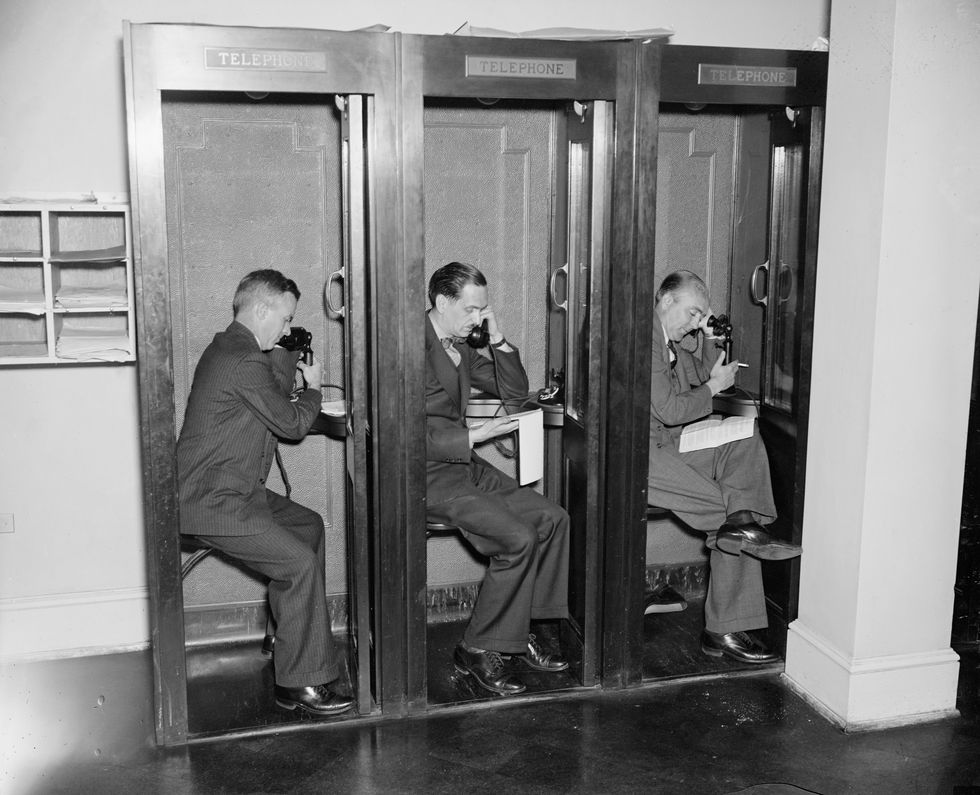 reporters in phone booths in press room, white house, washington dc, usa, circa 1937