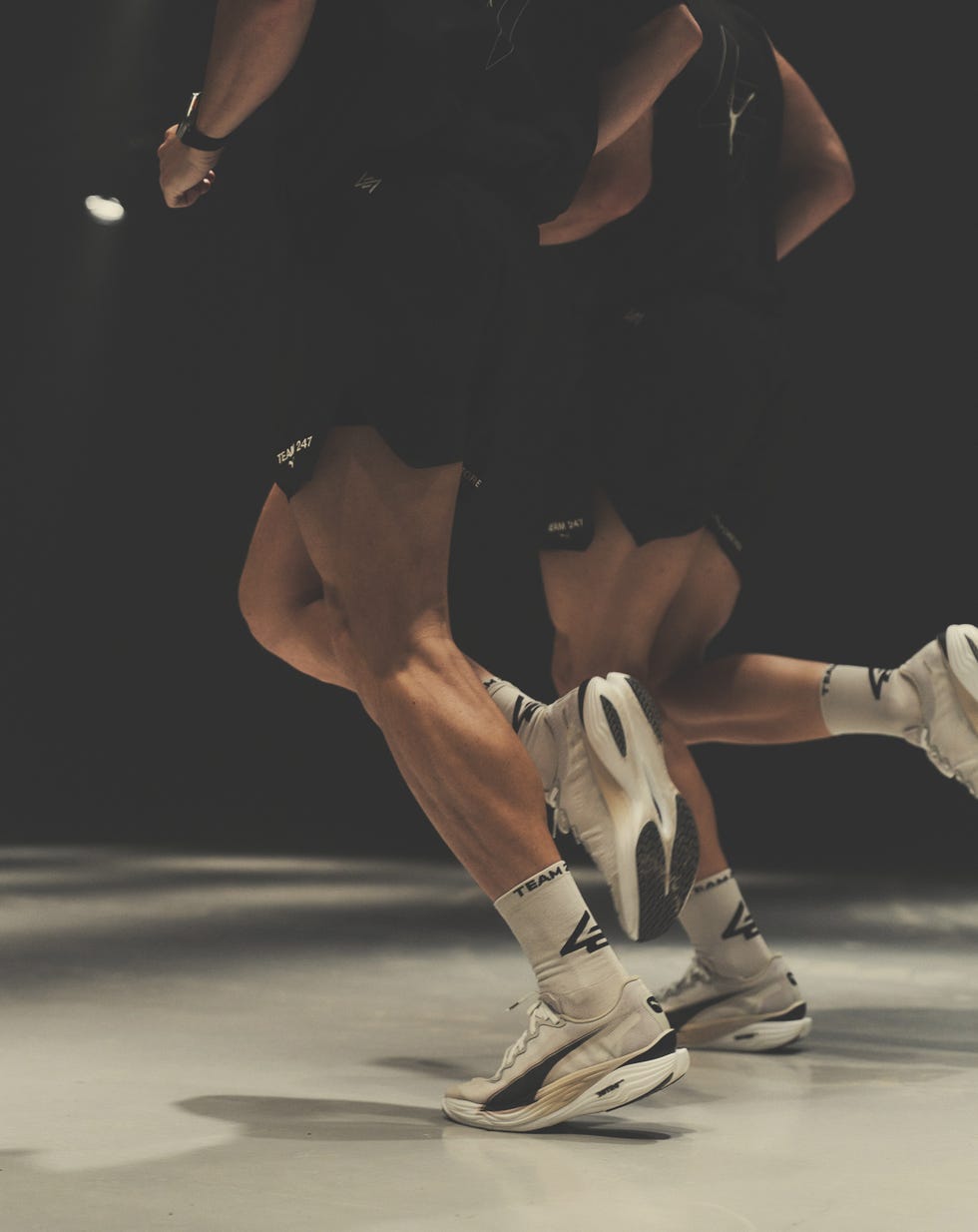 athletes running in a modern studio setting