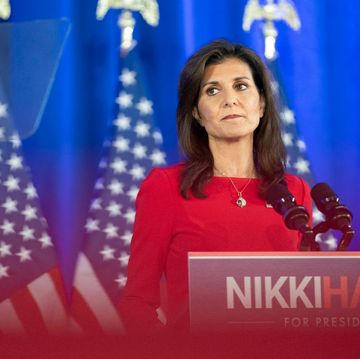 nikki haley standing at a podium with her name on it and looking out into the audience