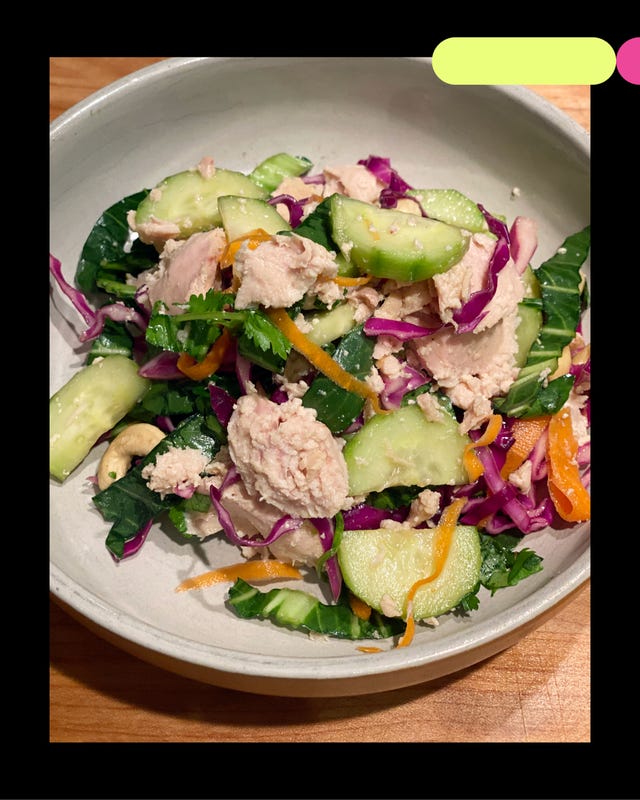 a bowl of salad with various vegetables and tuna a bowl of salad with various vegetables and tuna