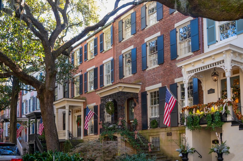 residential street in savannah decorated for christmas with american flags